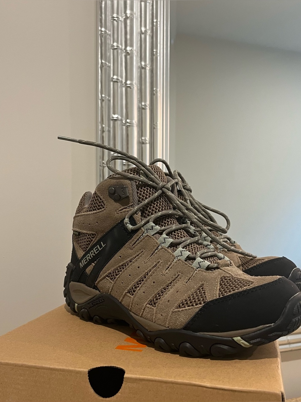 Merrell woman’s Tan and Black Hiking Shoes Mid-Top Trail